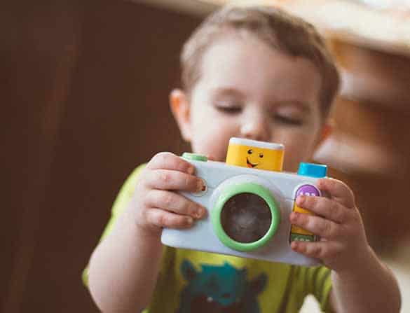 Child with Camera - Photo by Andrew Seaman on Unsplash