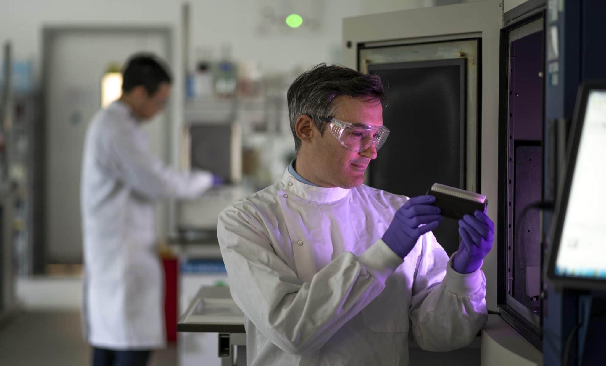 Scientists in a lab caring out an experiment