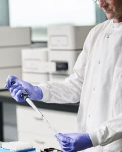 Scientist with a pipette