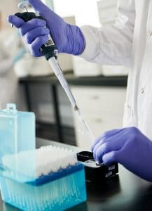 Scientist with pipette