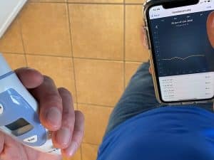 A tester uploads temperature and lung function data to an app.