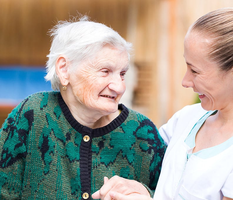 Photo of older woman with her carer
