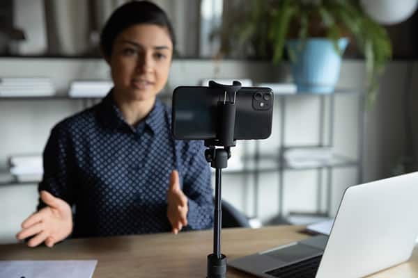 Young female speaker on a live meeting
