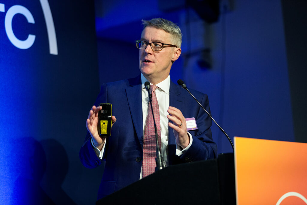 Patrick Chinnery speaking at a lectern at the LifeArc Translational Science Summit.