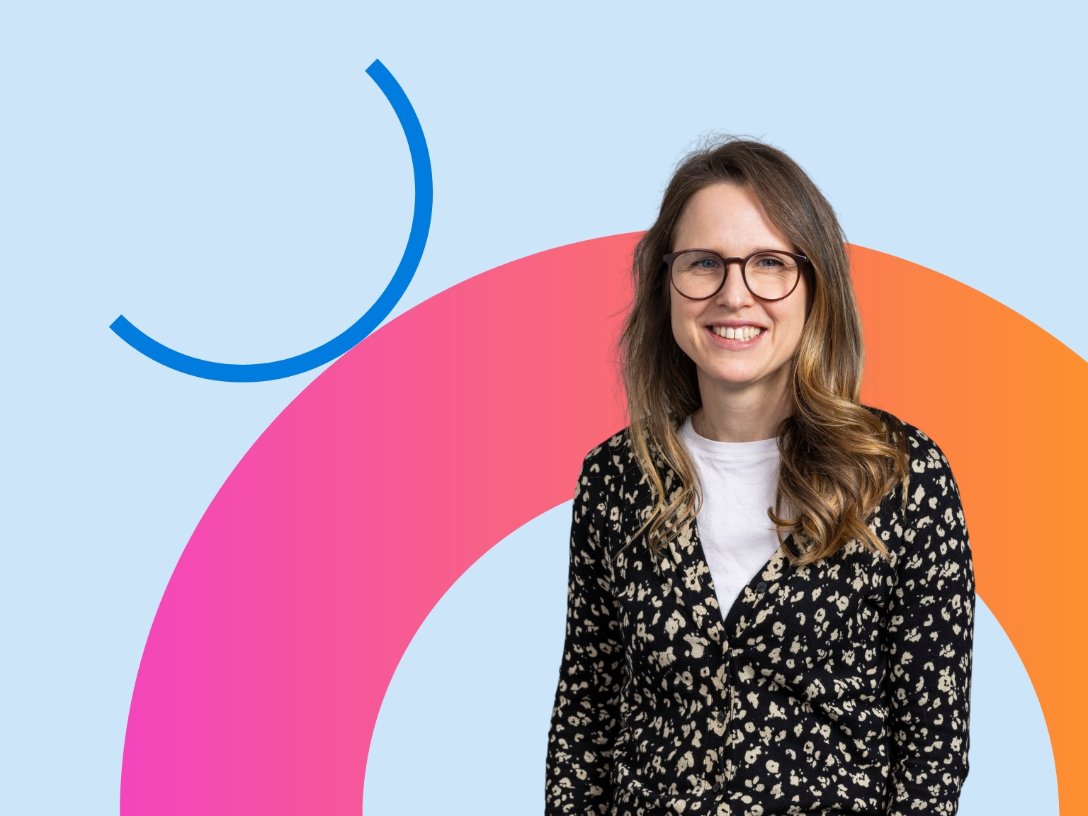 Rachel Dakin smiling at camera on light blue background with colour arc behind her