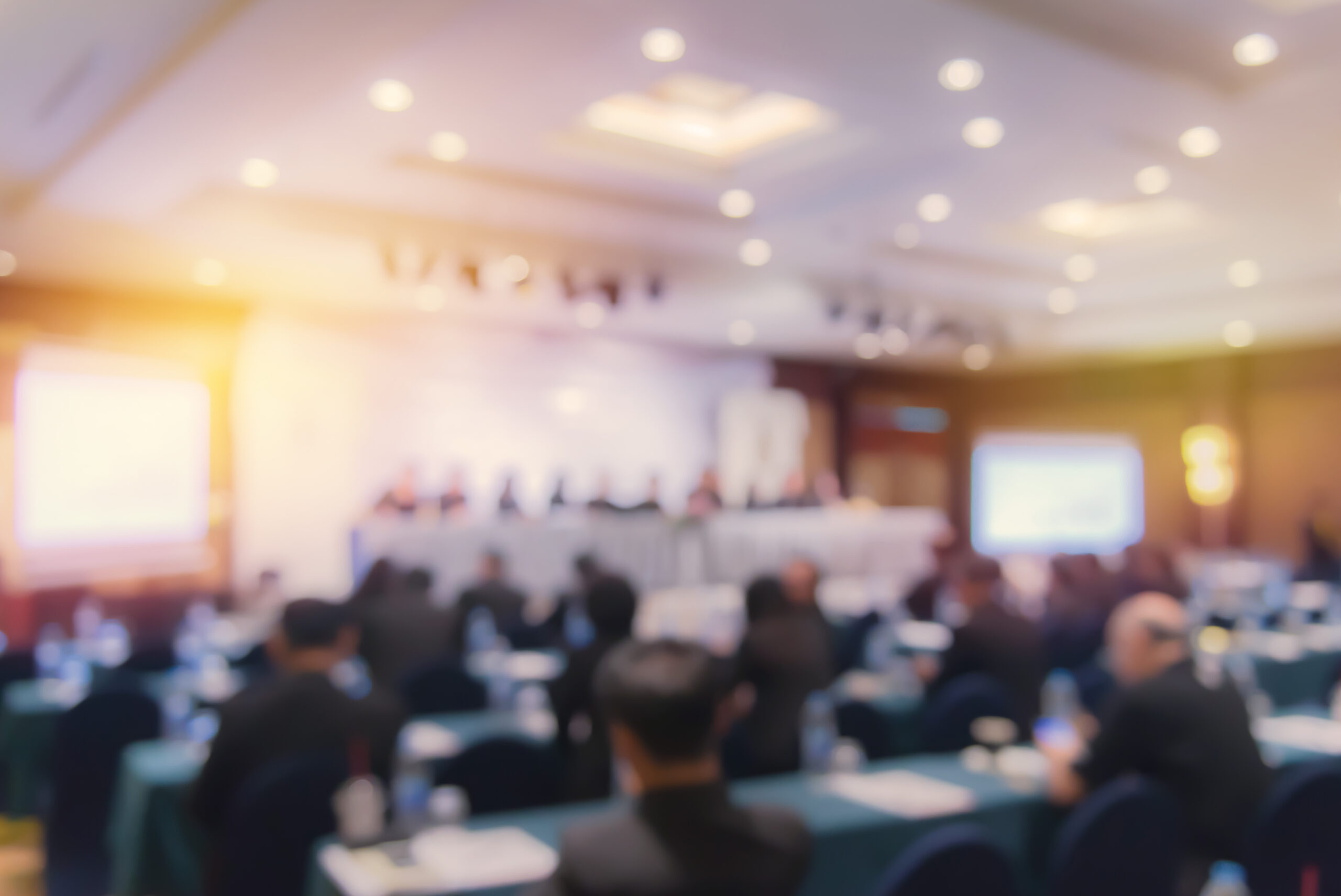 Defocused image of people at a conference