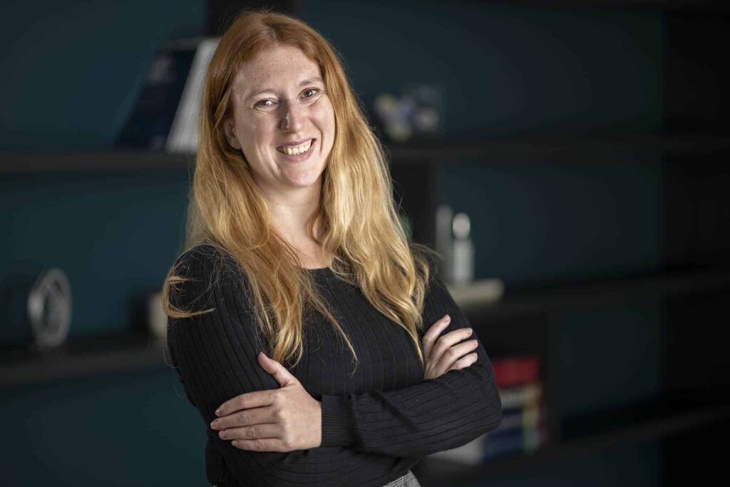 Portrait of Ffion Walters with her arms crossed facing the camera
