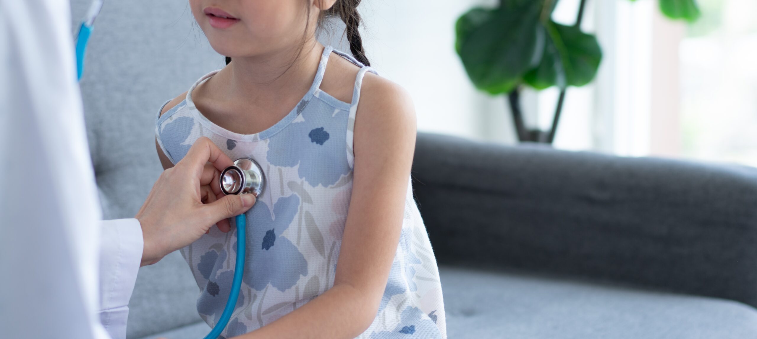 Close up of a doctor examining a child with a stethoscope