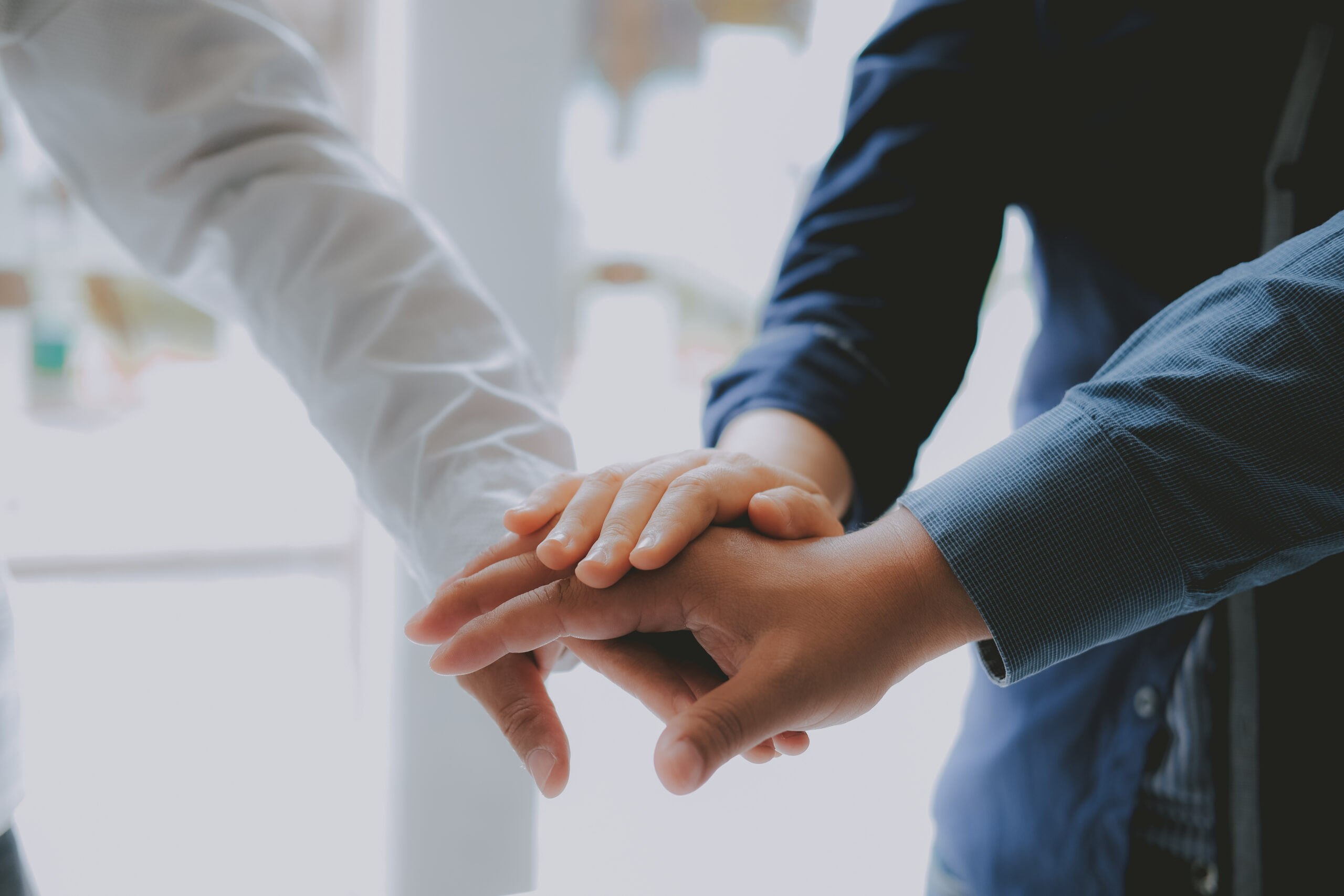 Hands on top of each other to show team work