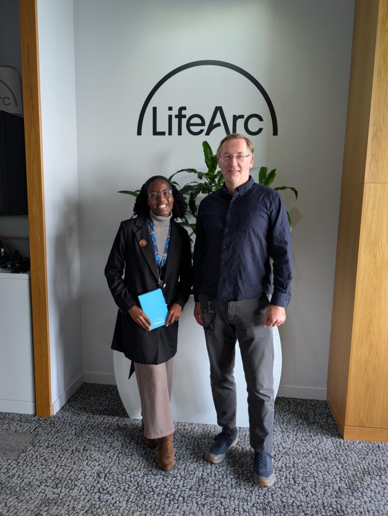 Varaidzo and her LifeArc line manager, a senior male LifeArc data scientist standing together smiling. 