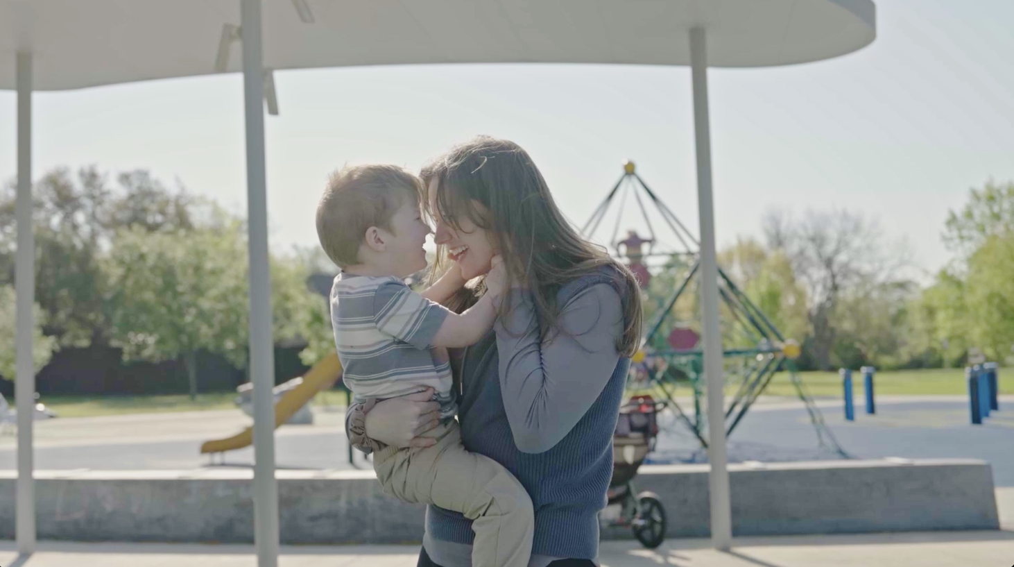 Elpida Therapeutics patient hugging his mum in a playground