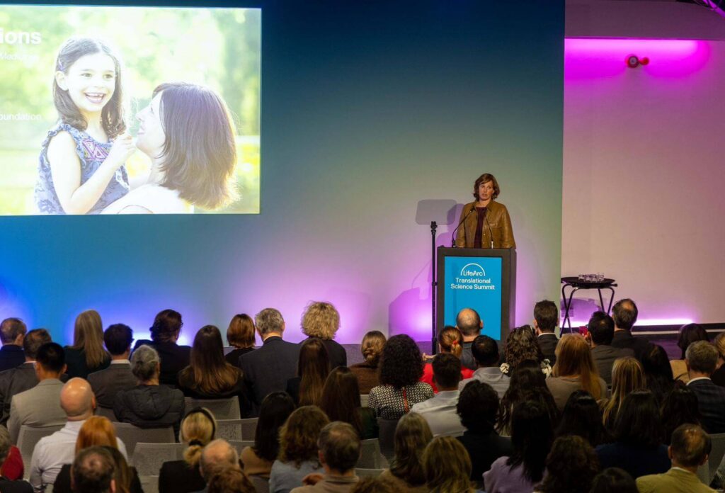 Julia Vitarello on stage at LifeArc Transaltional Science Summit delivering the closing keynote session.
