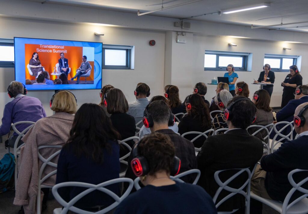 Delegates in the overflow area listening to the AI as a medical device debate at the LifeArc Translational Science Summit